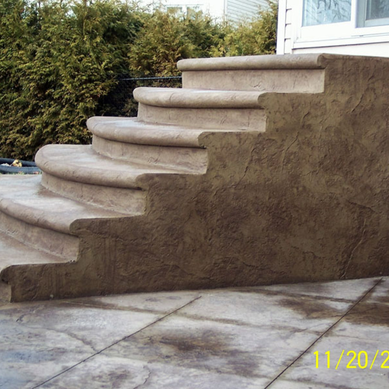 colored stamped concrete staircase with bullnose