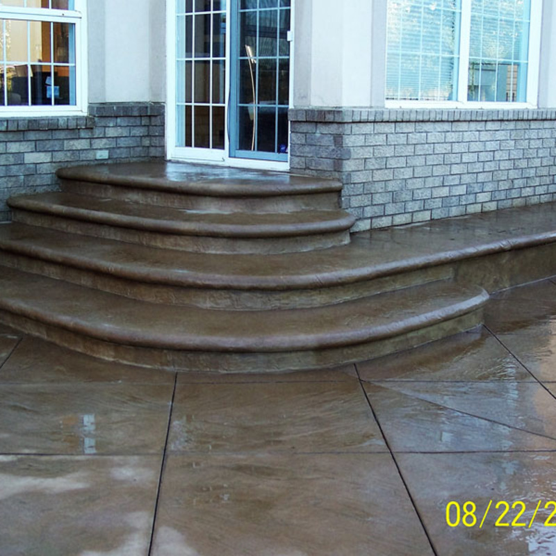 colored stamed concrete staircase with bullnose