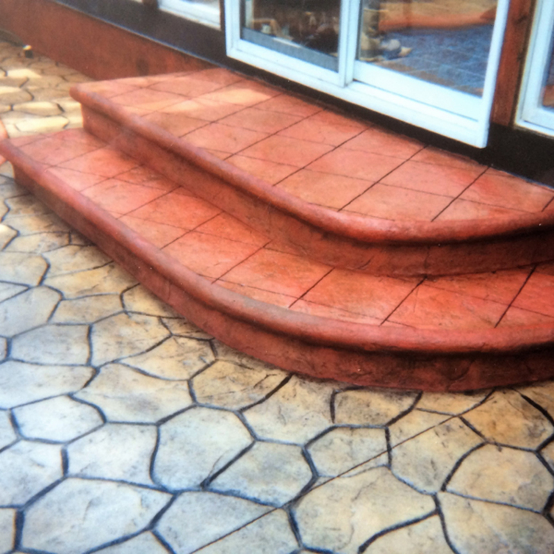 stamped concrete stair case colored stained concrete bullnose